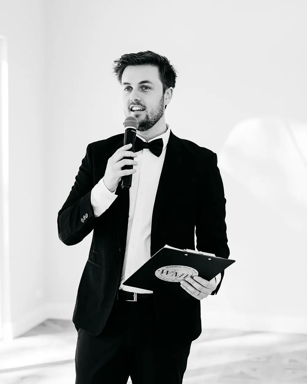 Mitchell Martin, Perth wedding MC, on the microphone at a reception