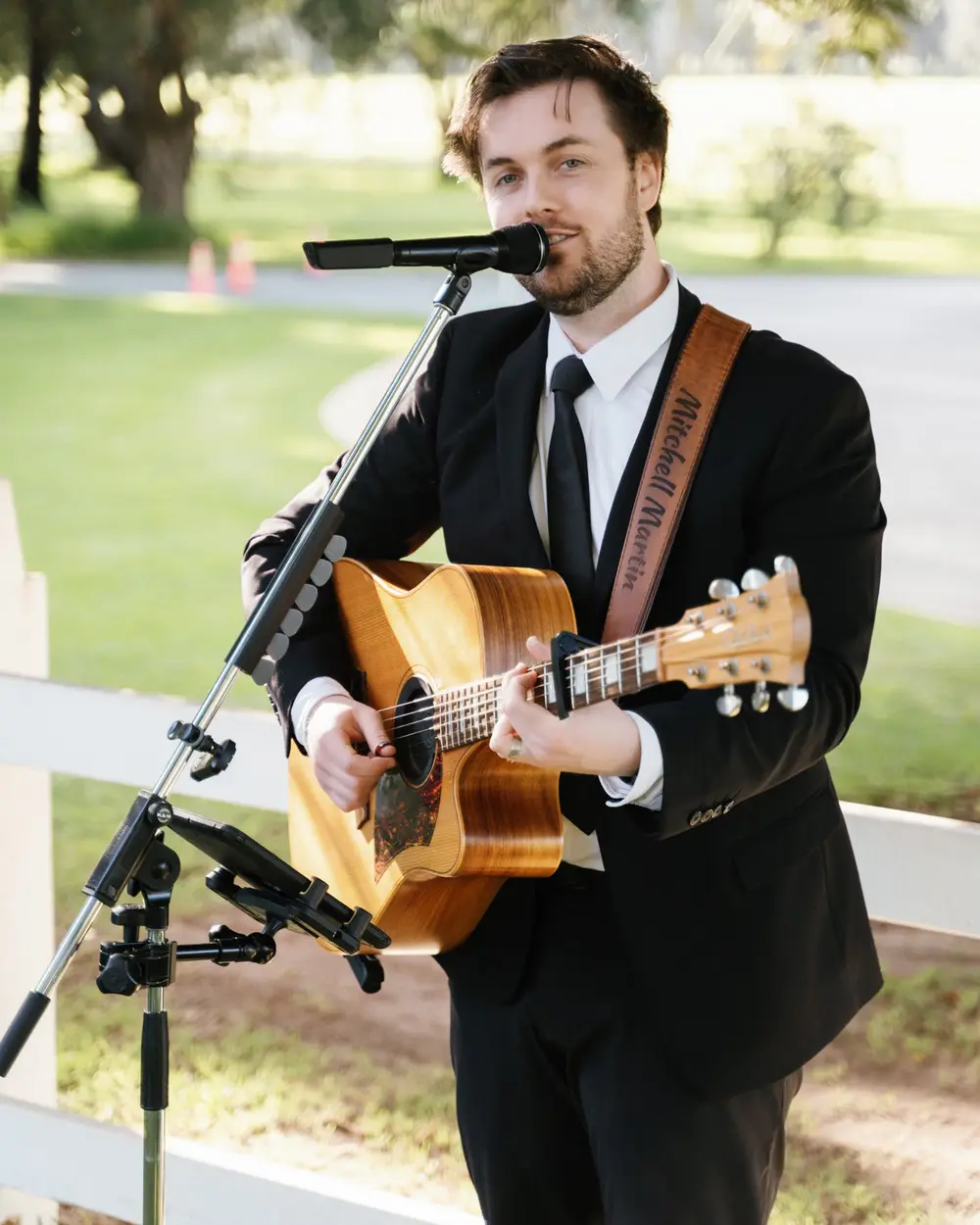 Mitchell Martin singing live with acoustic guitar at a Perth wedding