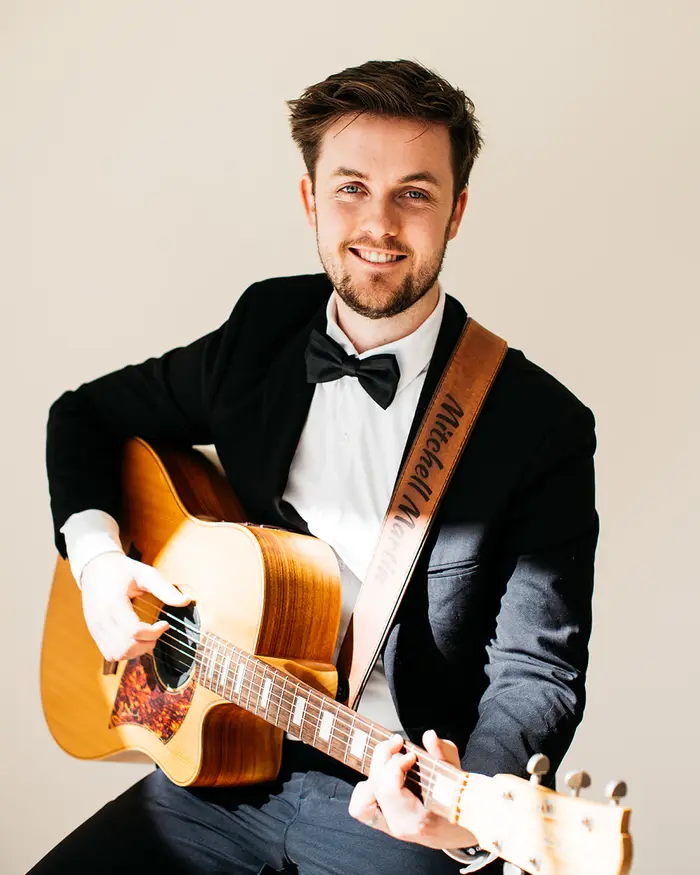 Mitchell Martin in black tie before a wedding ceremony